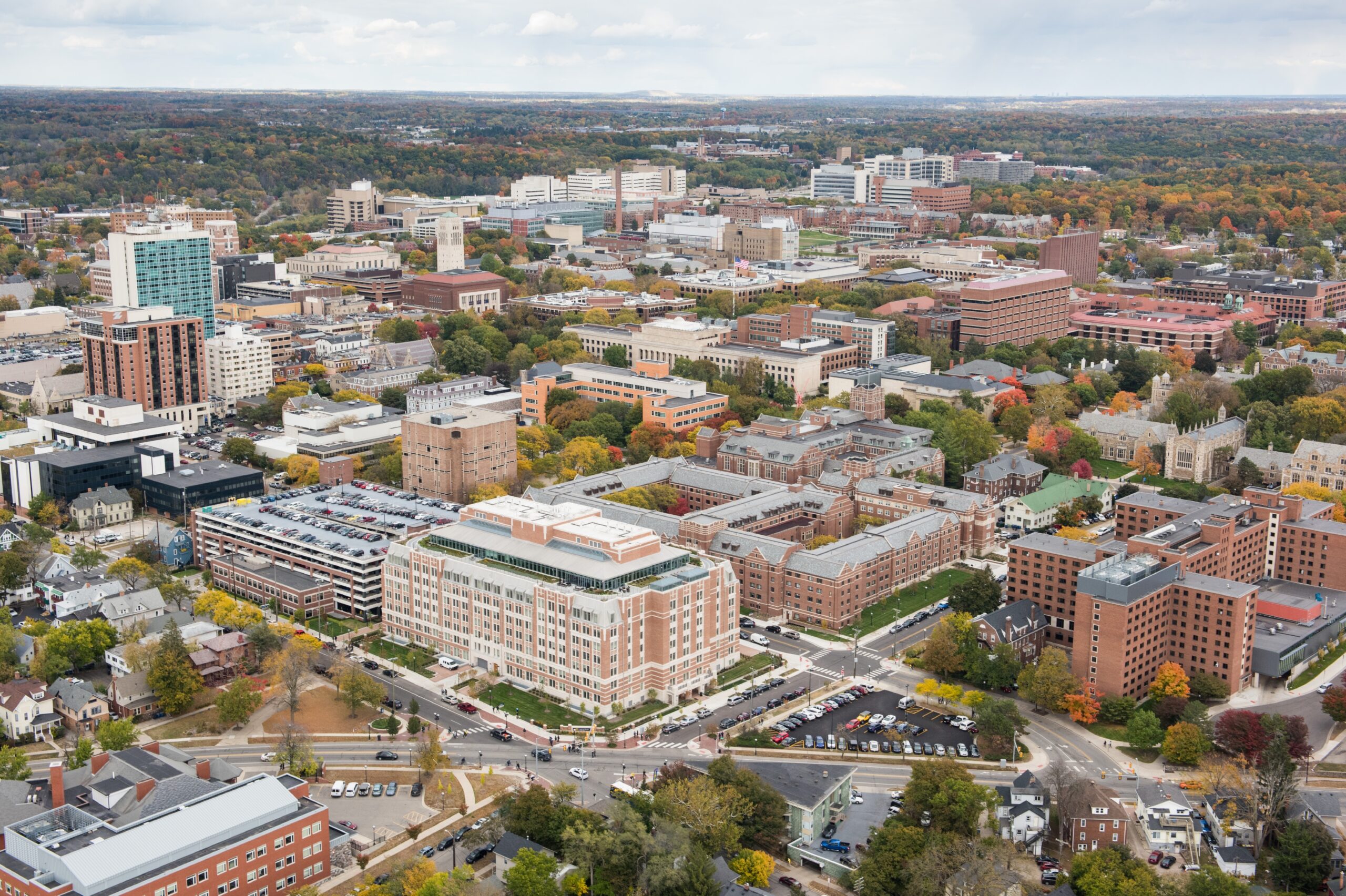 Fall aerials of Central Campus: Munger Graduate Residences, Fleming Building, Michigan Union, West Quad, South Quad, LSA, Business School, Law School.