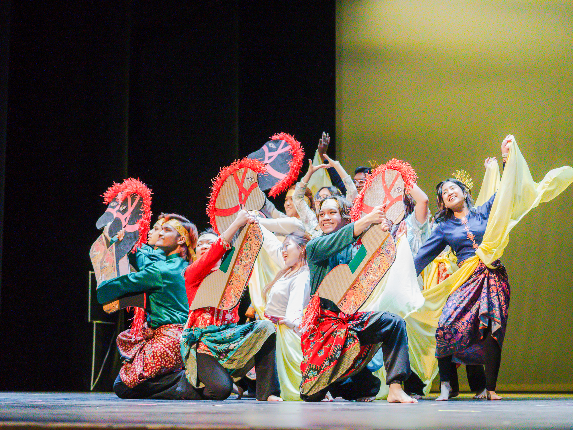 Photo of students performing in traditional regalia