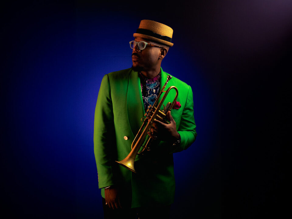 Photo of musician Etienne Charles with his trumpet