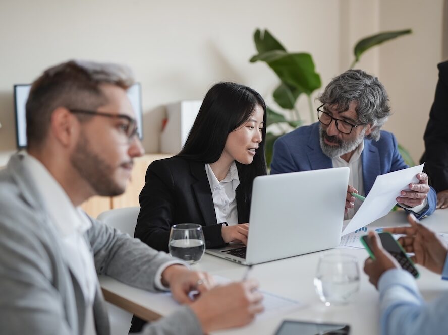 Multiracial business people working inside coworking office