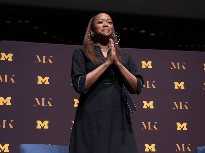 Erika Alexander with hands clasped